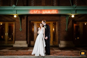 Outside Cafe Brauer in Lincoln Park, Chicago, IL, a night portrait captures the bride and groom in a center-framed, symmetrical composition.